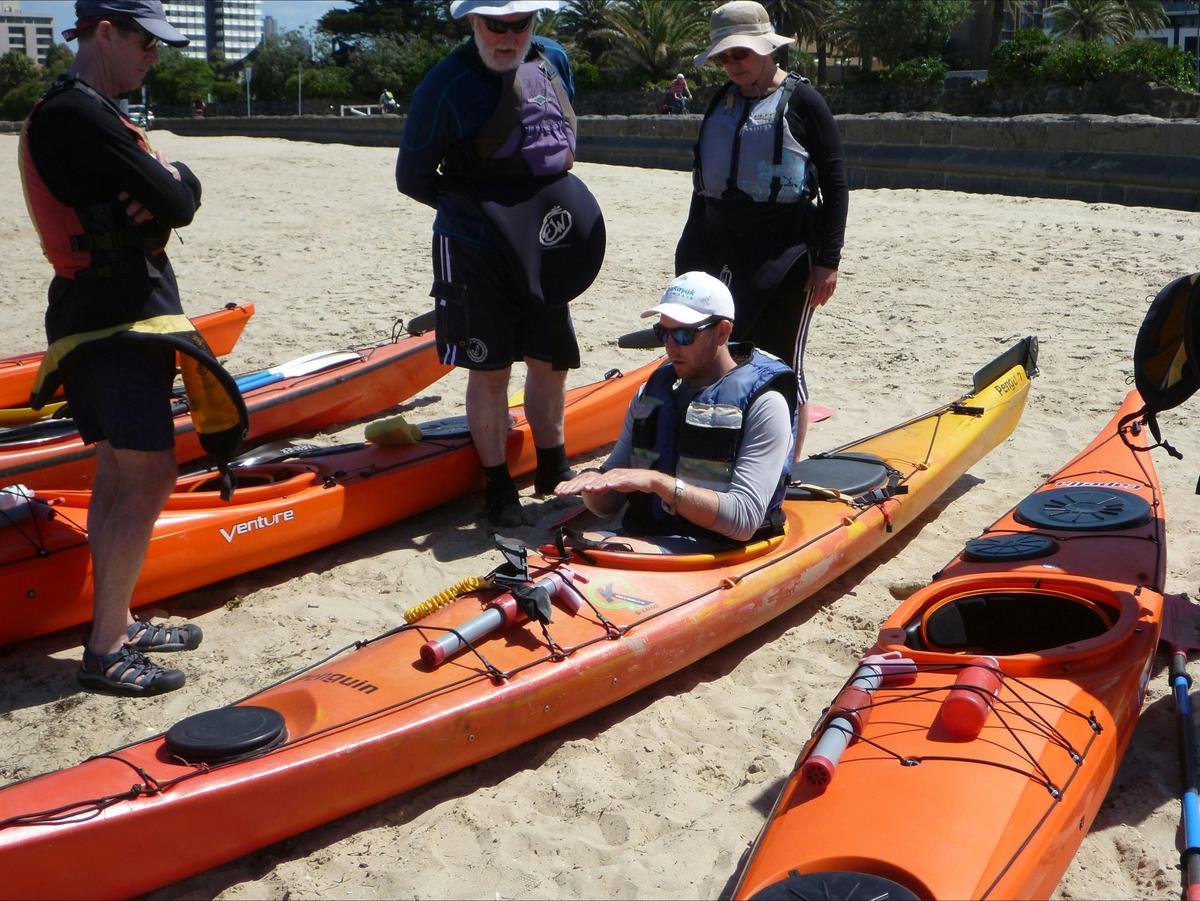 Explaining the rudder system on a Introduction to Sea Kayaking Course