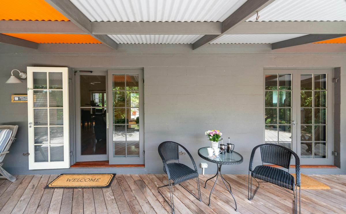 Patio with all doors opening with garden views