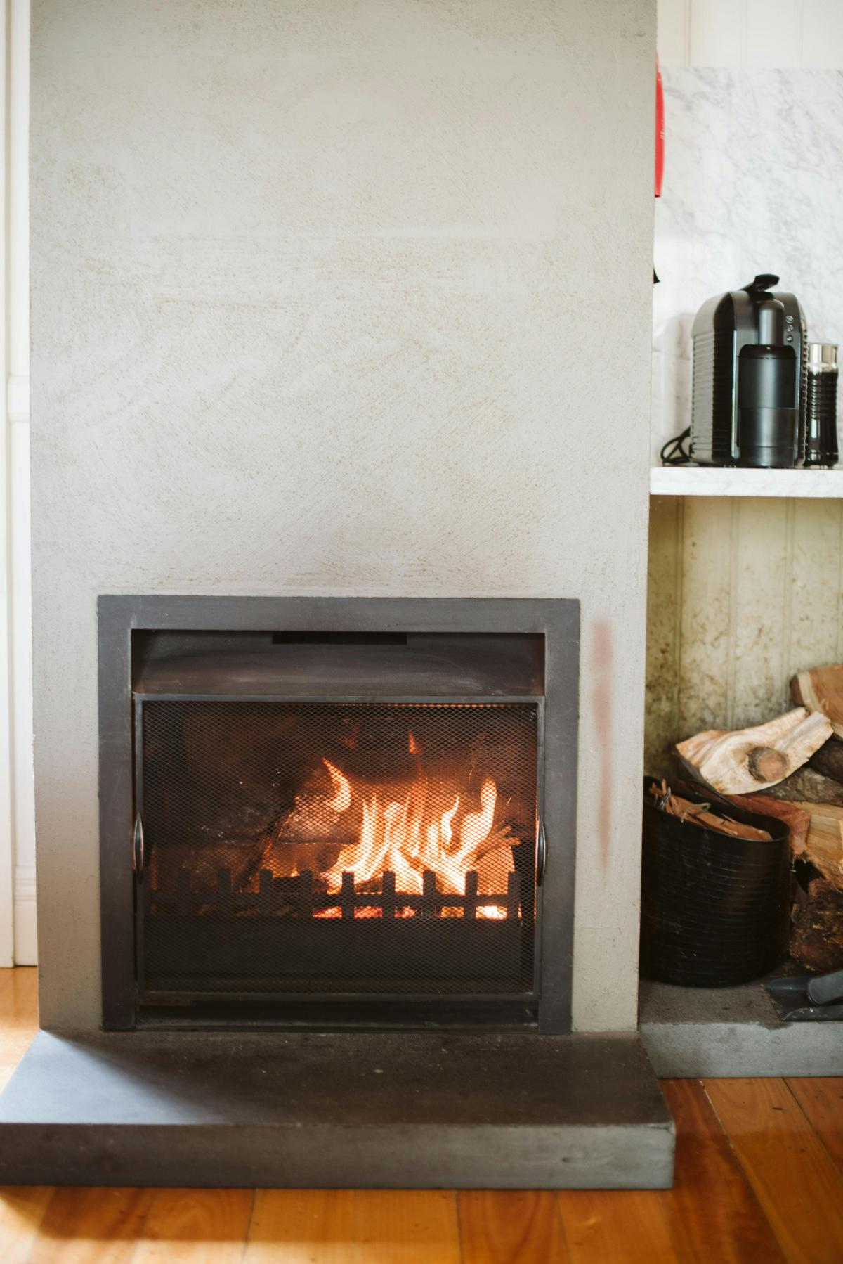 Open log fire in Rhyll Haven Cottage
