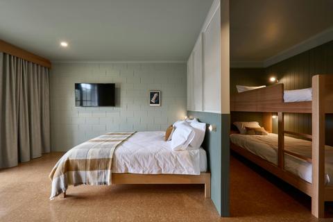 Queen bed with Bunks behind  - The Nest