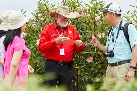Gardens guide with two visitors