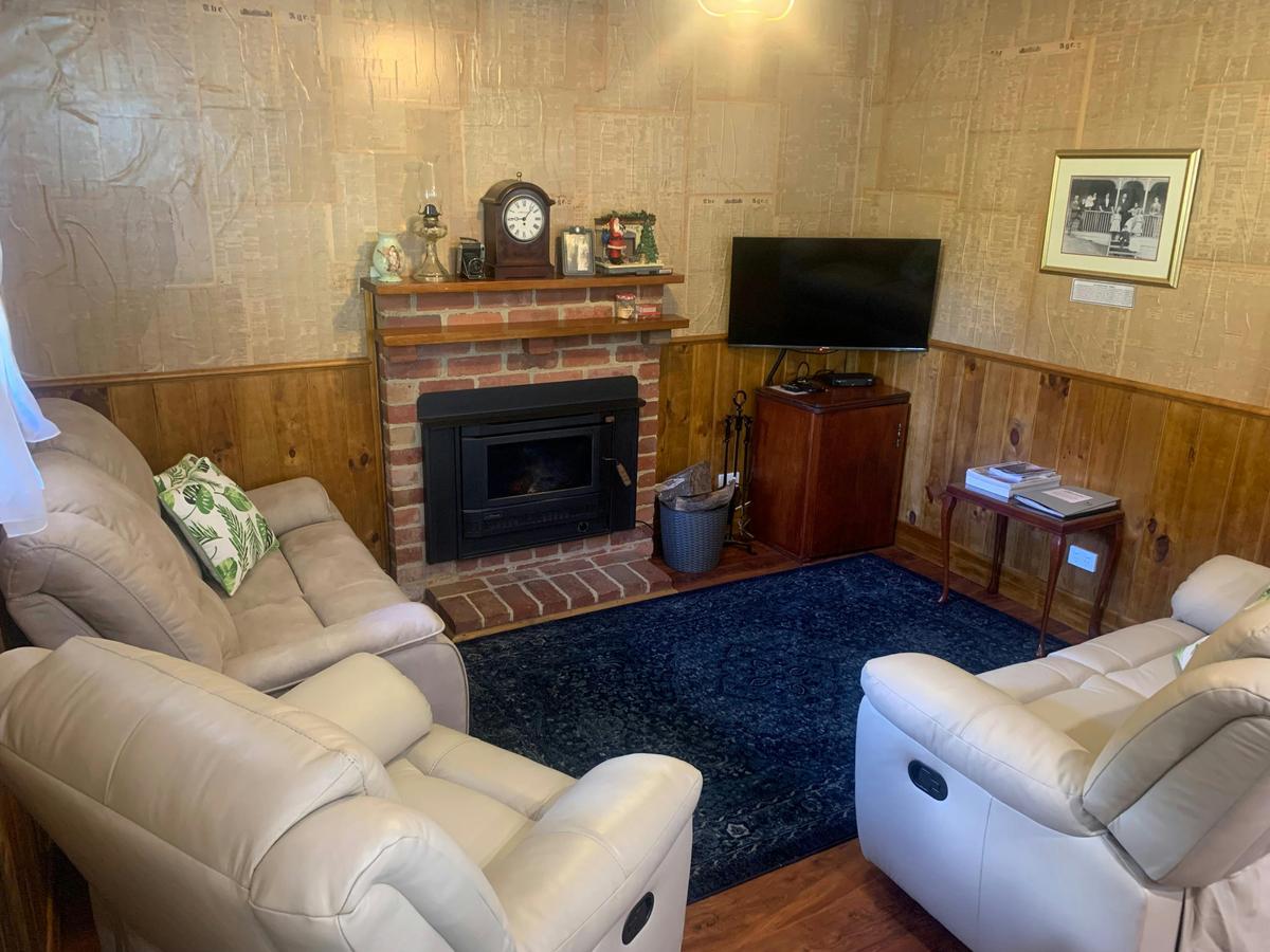 The cosy lounge with wood fire.