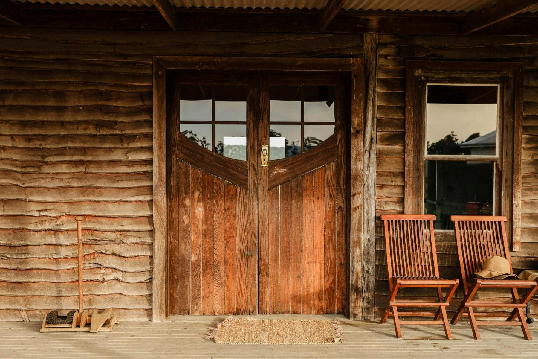 Outdoor wooden area with wooden chairs