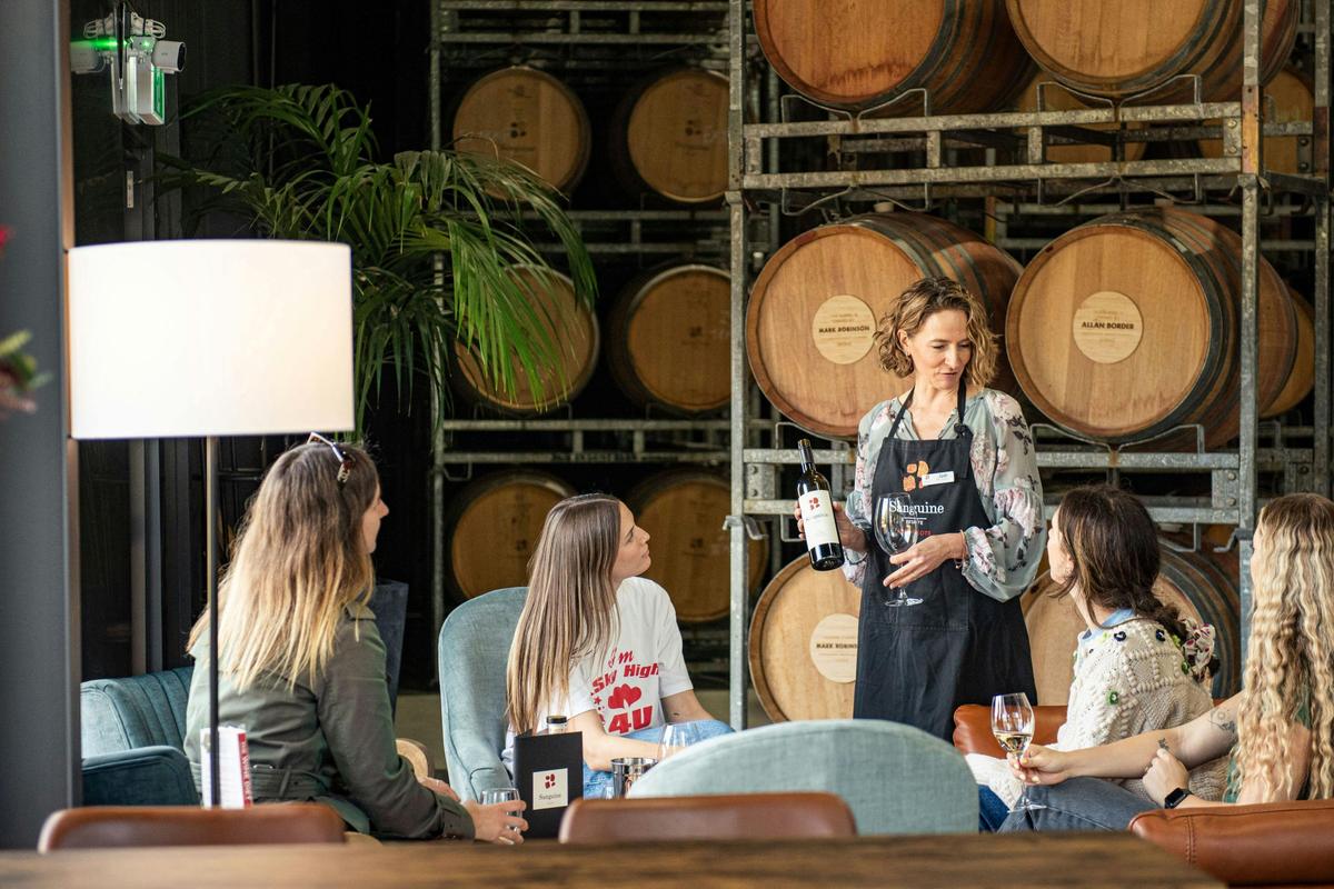 Guests enjoying a tutored wine tasting with Jodi (CEO/Daughter) at their beautiful cellar door