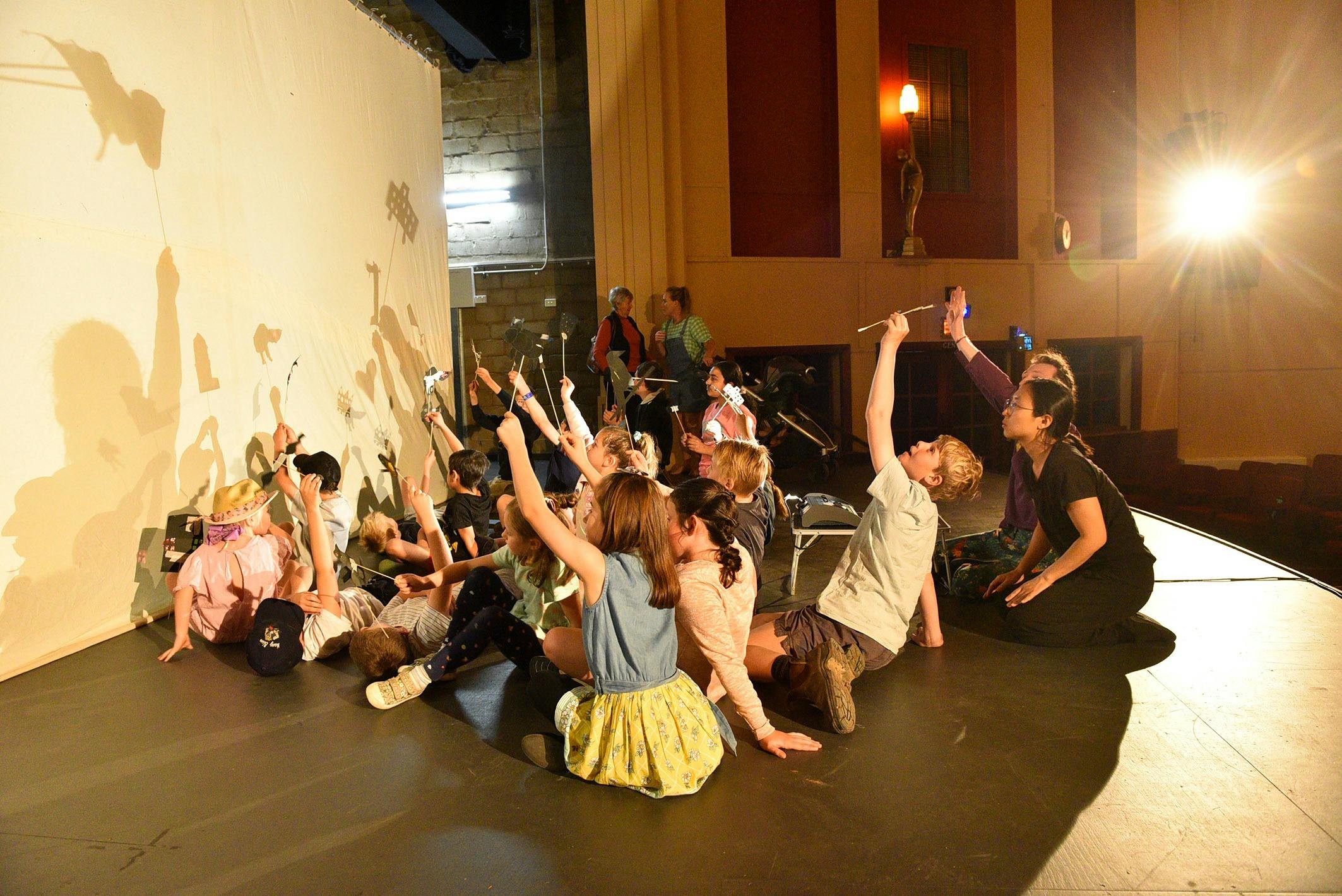 Putting shadow puppets to use on The Rex screen following the puppet-making workshop