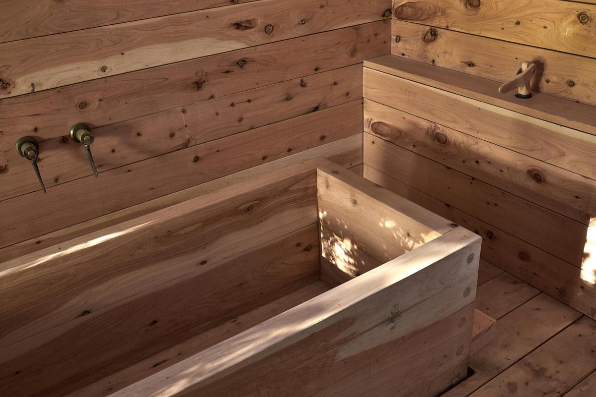 Japanese inspired wooden bath made from reclaimed local Cypress from the surrounding hills.