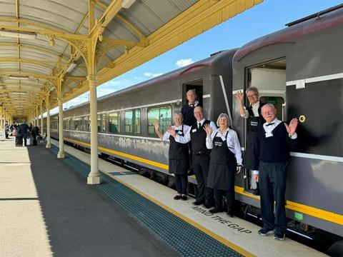 Onboard staff greet passengers