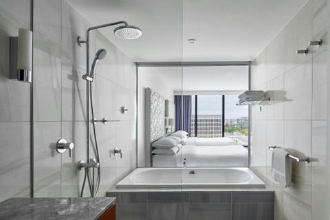Guest room bathroom with bathtub