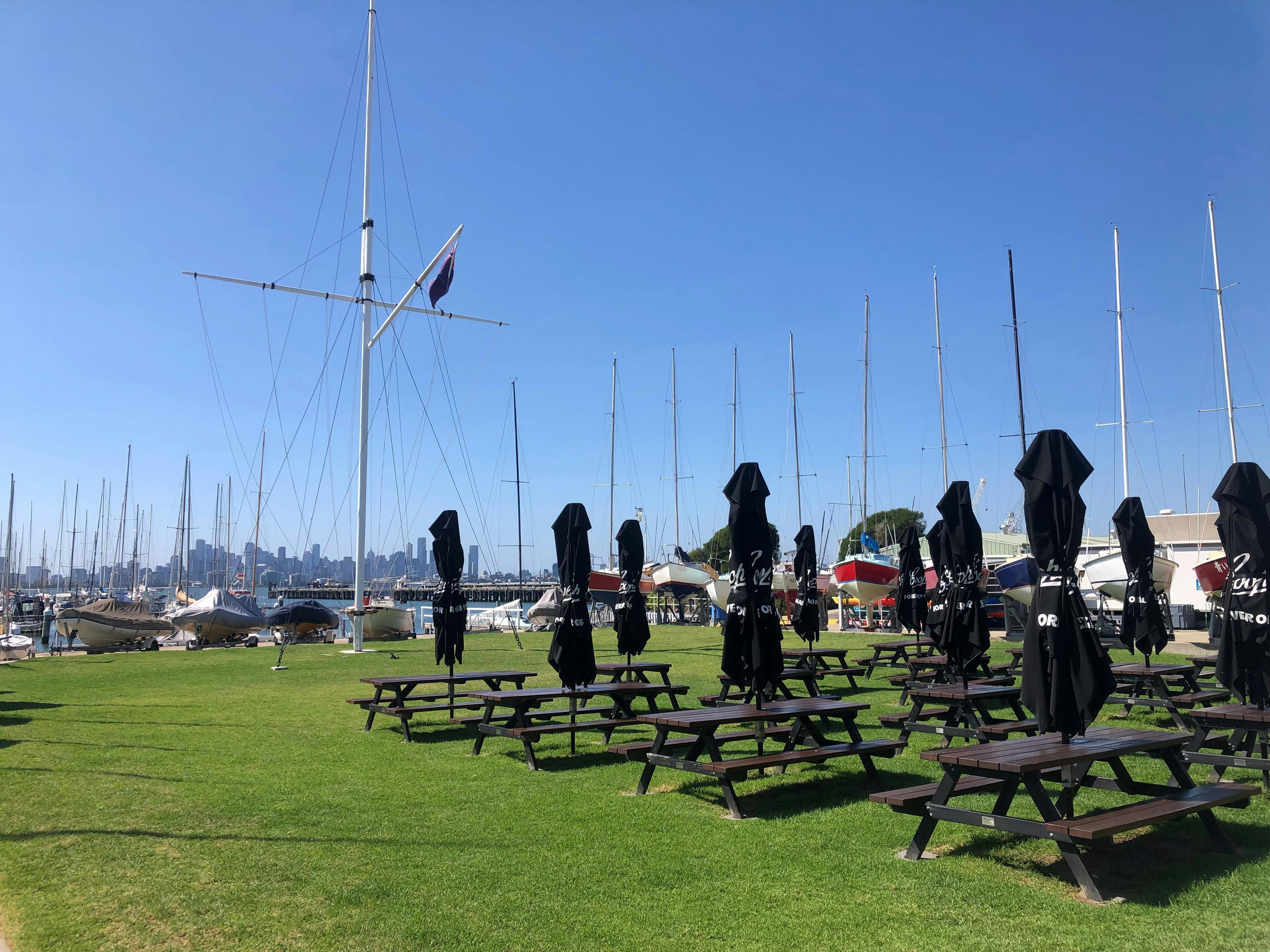 Lawn with picnic tables and umbrellas