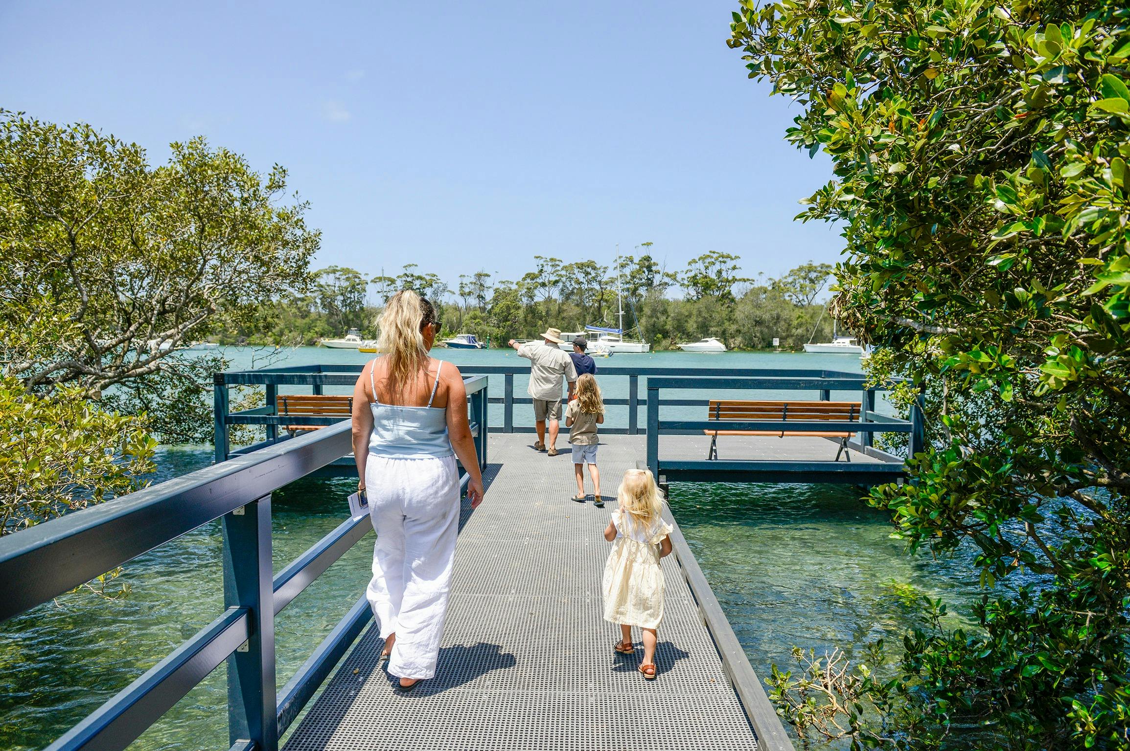 Family walking towards end of boardwalk