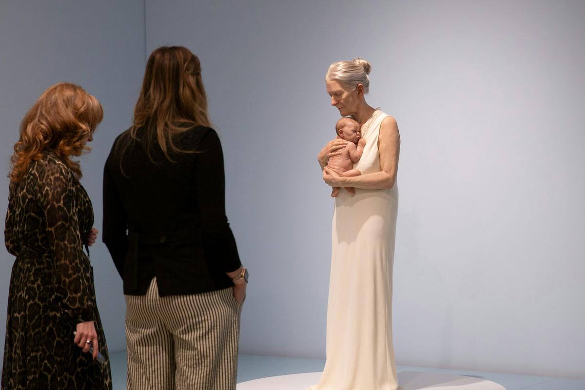 Visitors viewing SAM Collection work 'Woman and Child' by Sam Jinks