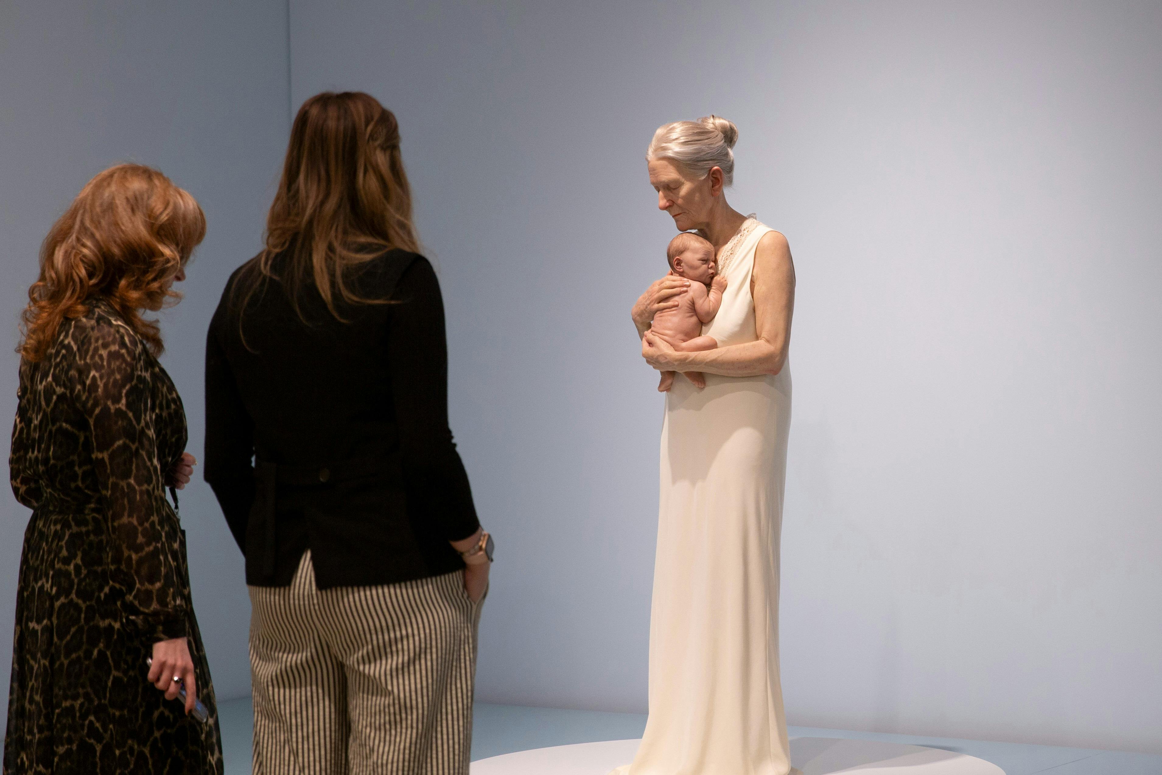 Visitors viewing SAM Collection work 'Woman and Child' by Sam Jinks