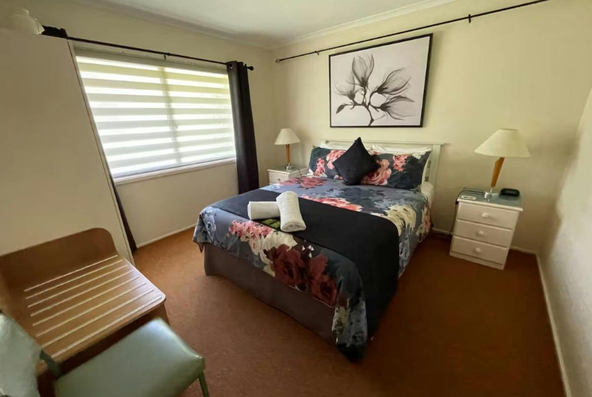 Queen size bed in a cabin style room