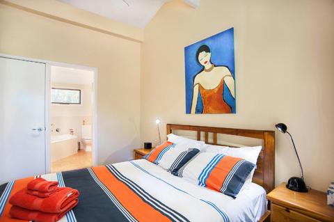 Spacious bathroom with spa bath just off the bedroom