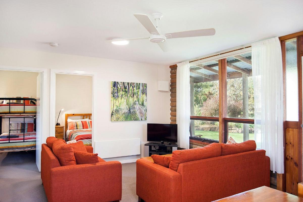 A family cottage with comfortable bedding and sofas