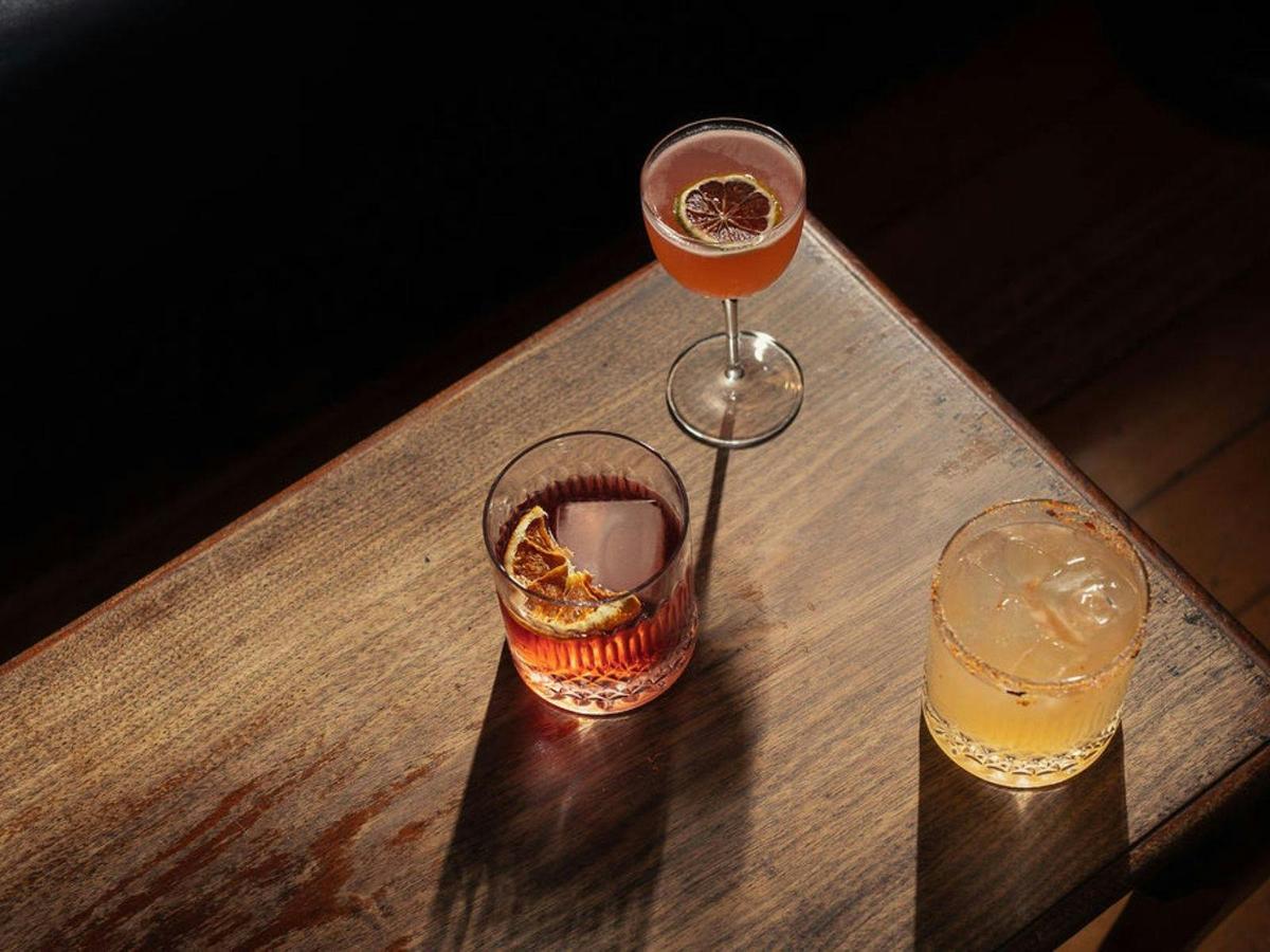 three glasses with cocktails