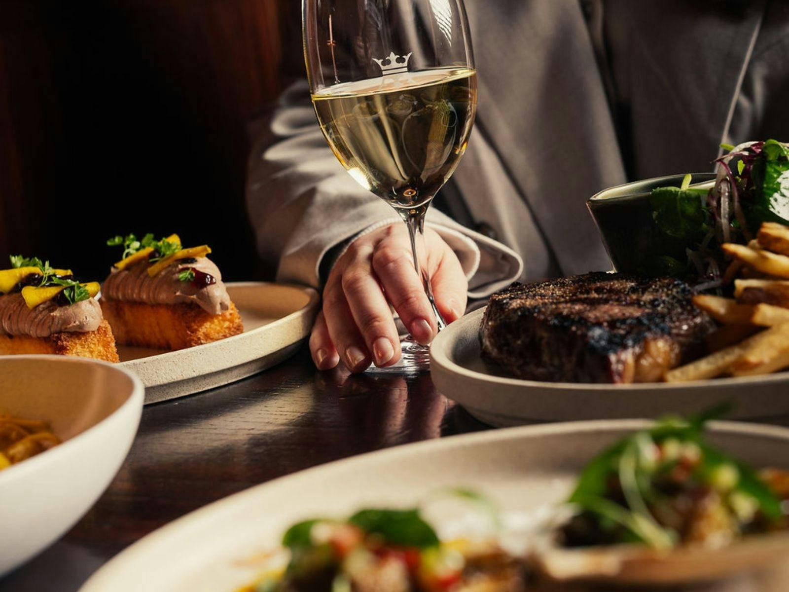 a glass of wine and some dishes