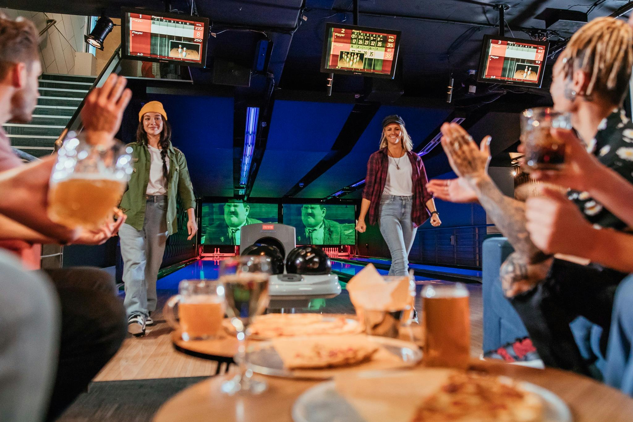 Enjoying food and beverages while bowling