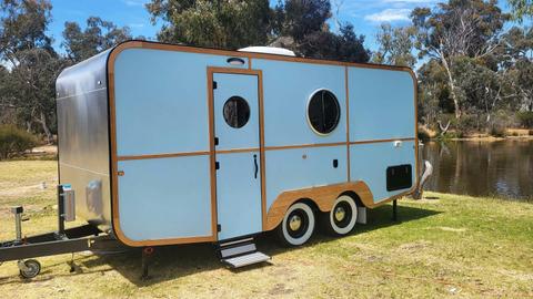 Light blue caravan HV3 with round windows at Stawell Grampians Gate Hotel Motel
