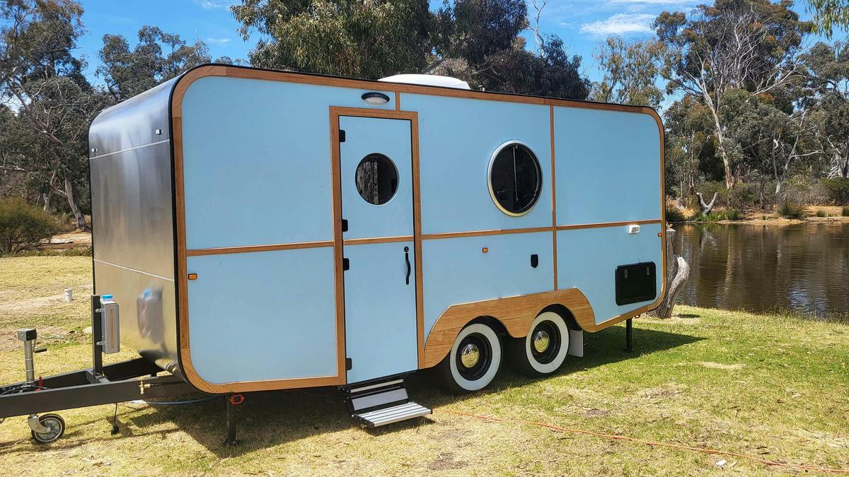 Light blue caravan HV3 with round windows at Stawell Grampians Gate Hotel Motel