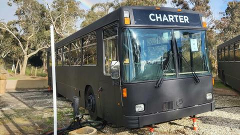 Black Bus 4, converted into stylish accommodation, parked at Stawell Grampians Gate Hotel Motel