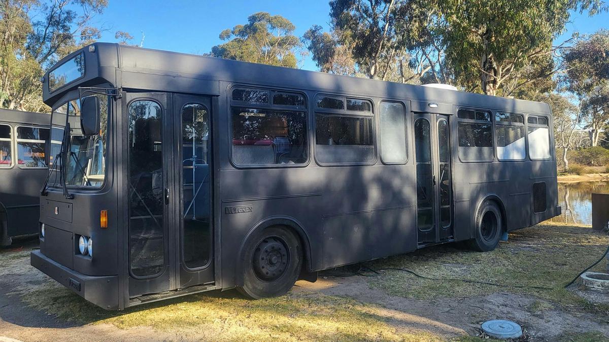 Stylish black Bus 1, converted for accommodation, at Stawell Grampians Gate Hotel Motel