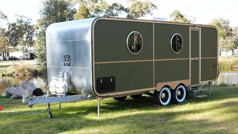 HV2 silver caravan with wooden accents and round windows at Stawell Grampians Gate Hotel Motel