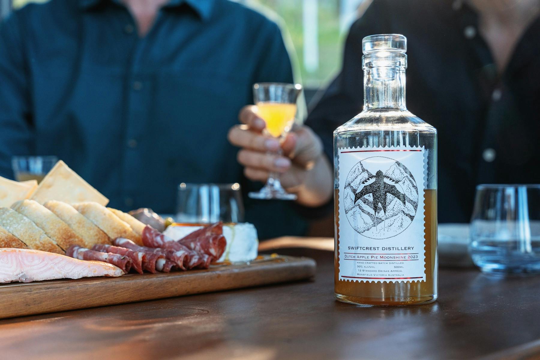 Dutch Apple Pie Moonshine cocktails with local charcuterie at Swiftcrest.