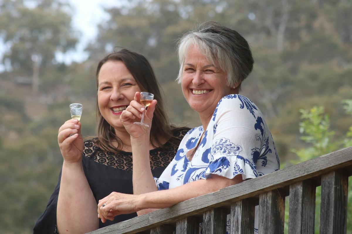 Silver Mink Tours guests on verandah of Mrs Bakers Still House cellar door. Pyrenees, Vic.