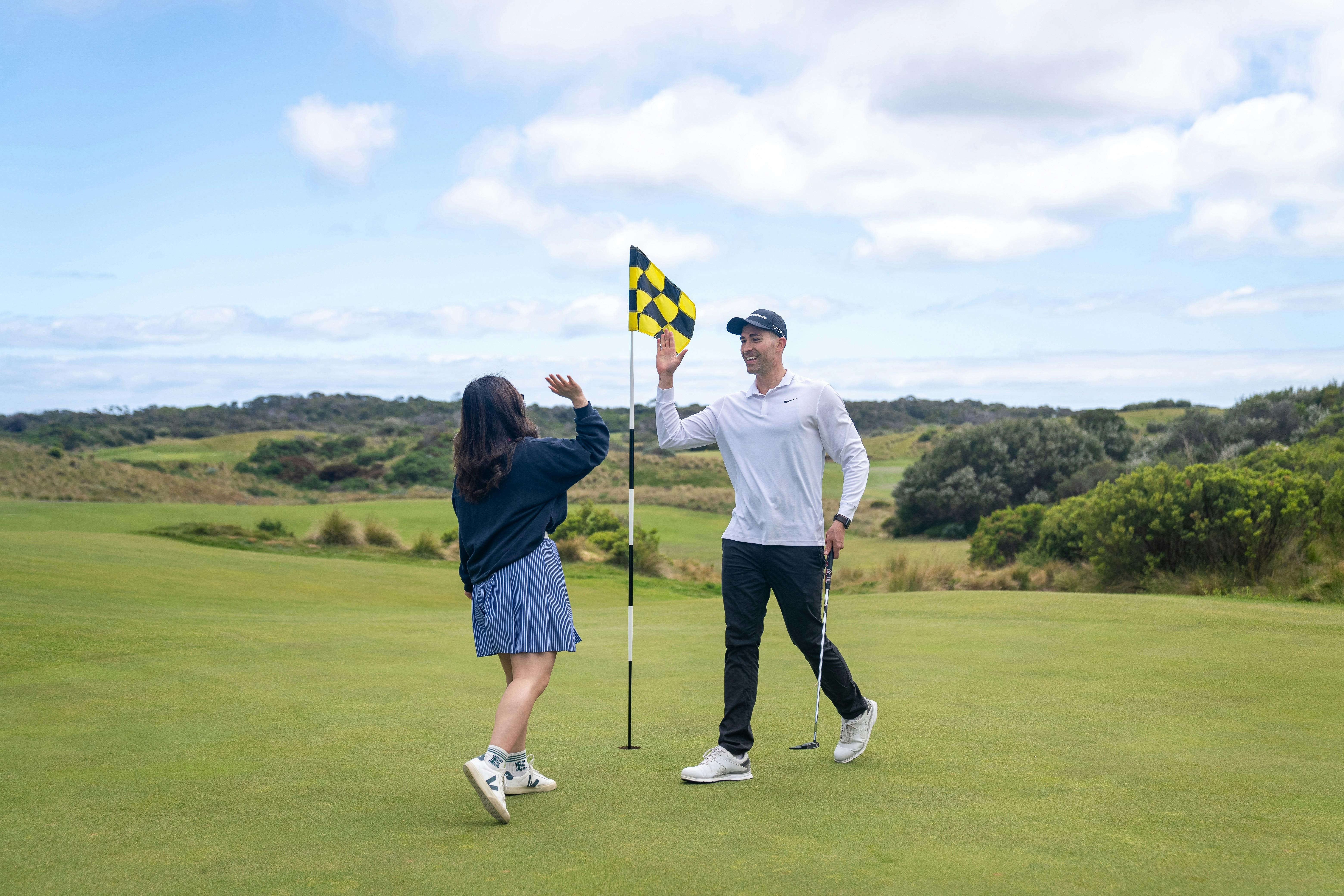 Two golfers celebrating at St Andrew Beach Golf Course