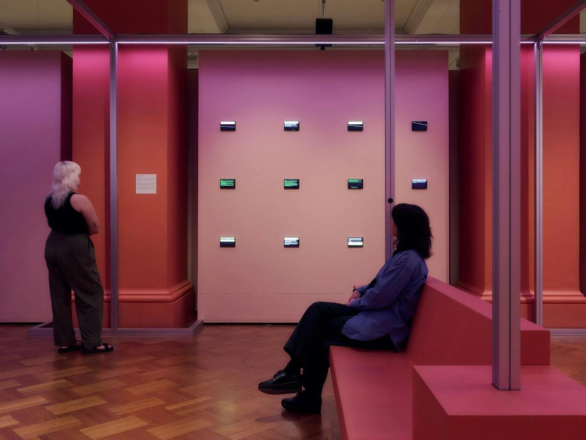 Two people inside Rebel Heart exhibition