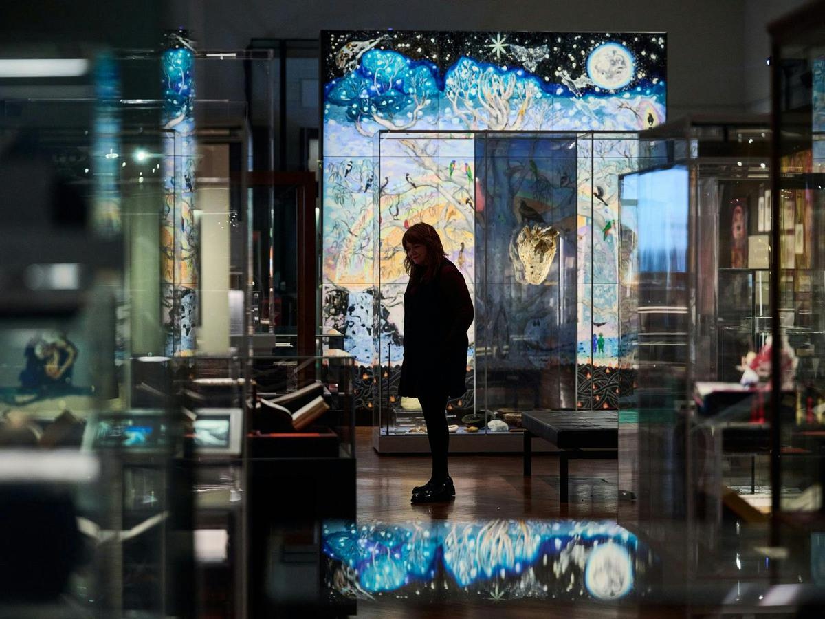 A person looking at artwork in State Library Victoria