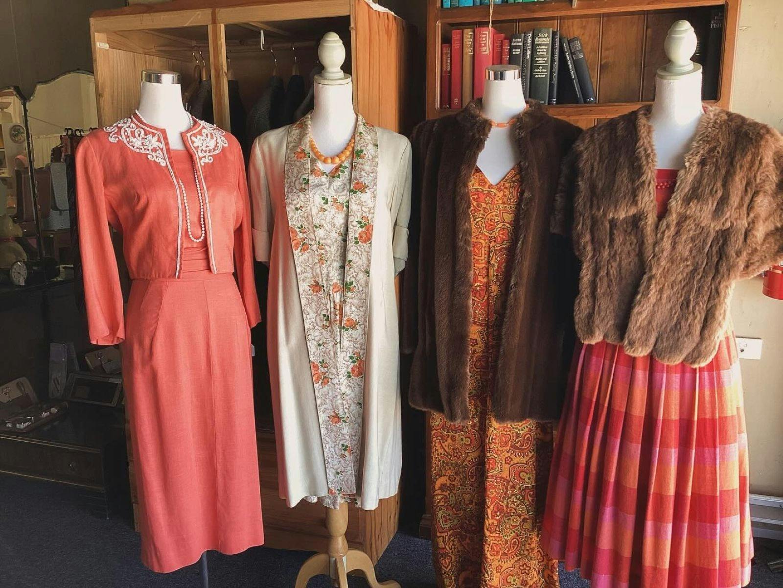 Four mannequins all dressed in vintage clothing and furs