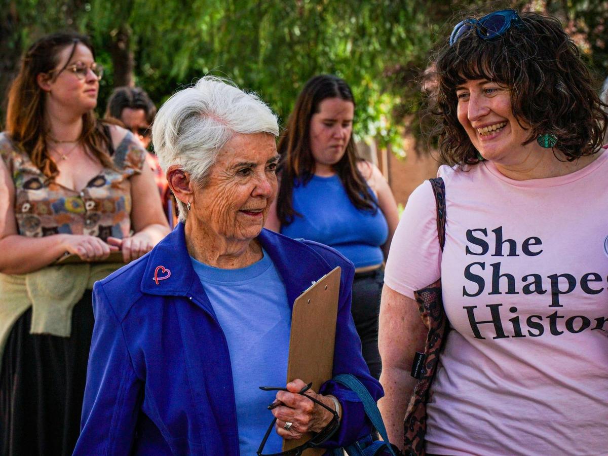 She Shapes History tour guide talking to a guest