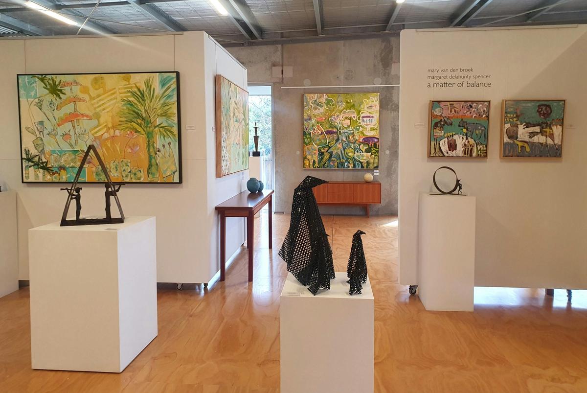 Upstairs exhibition of Margaret Delahunty Spencer paintings and Mary van den Broek sculpture