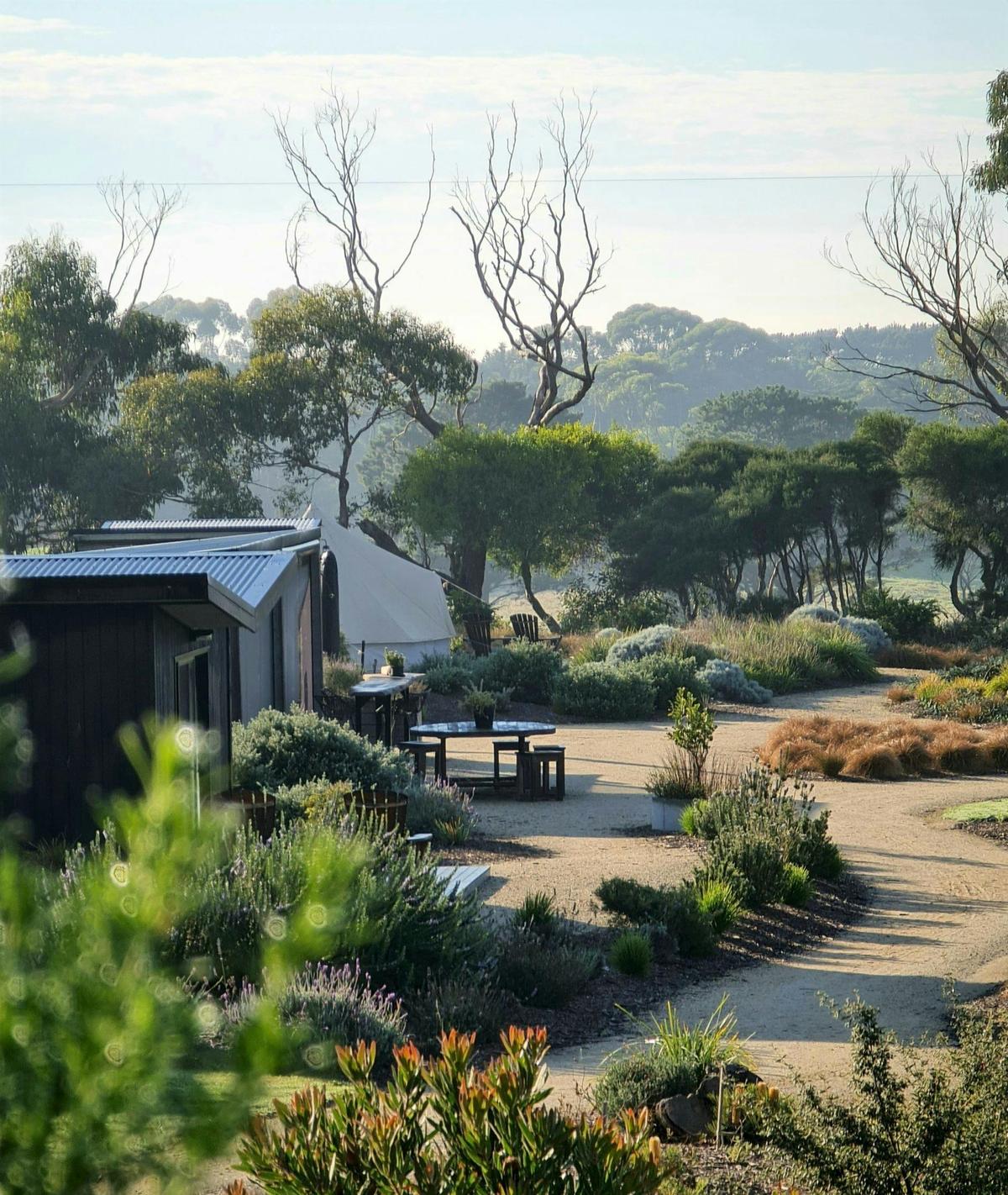 @ cabins, a geodesic dome tent and 2 luxury canvas structures in landscaped garden with ocean views
