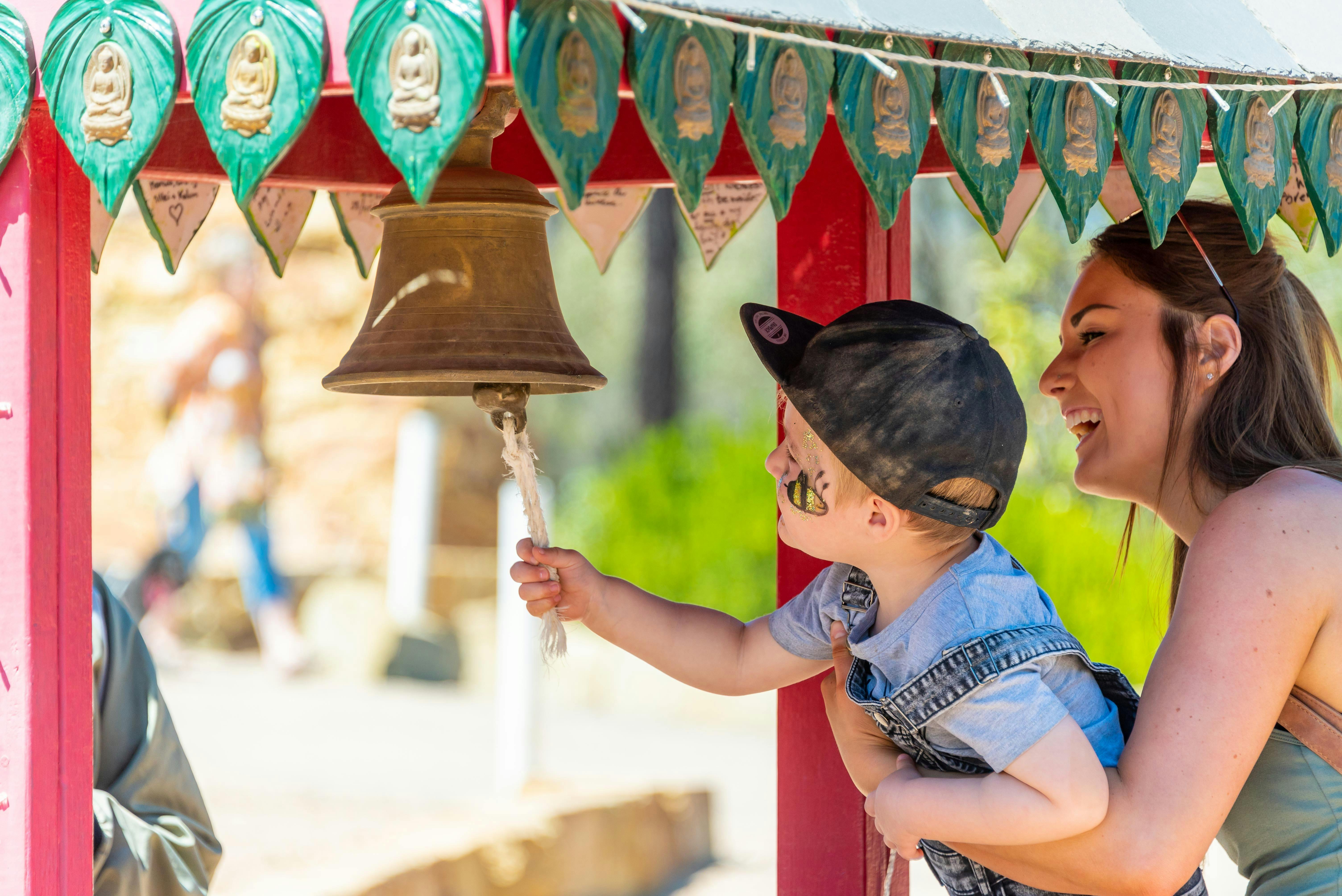 Mother and child at wishing well