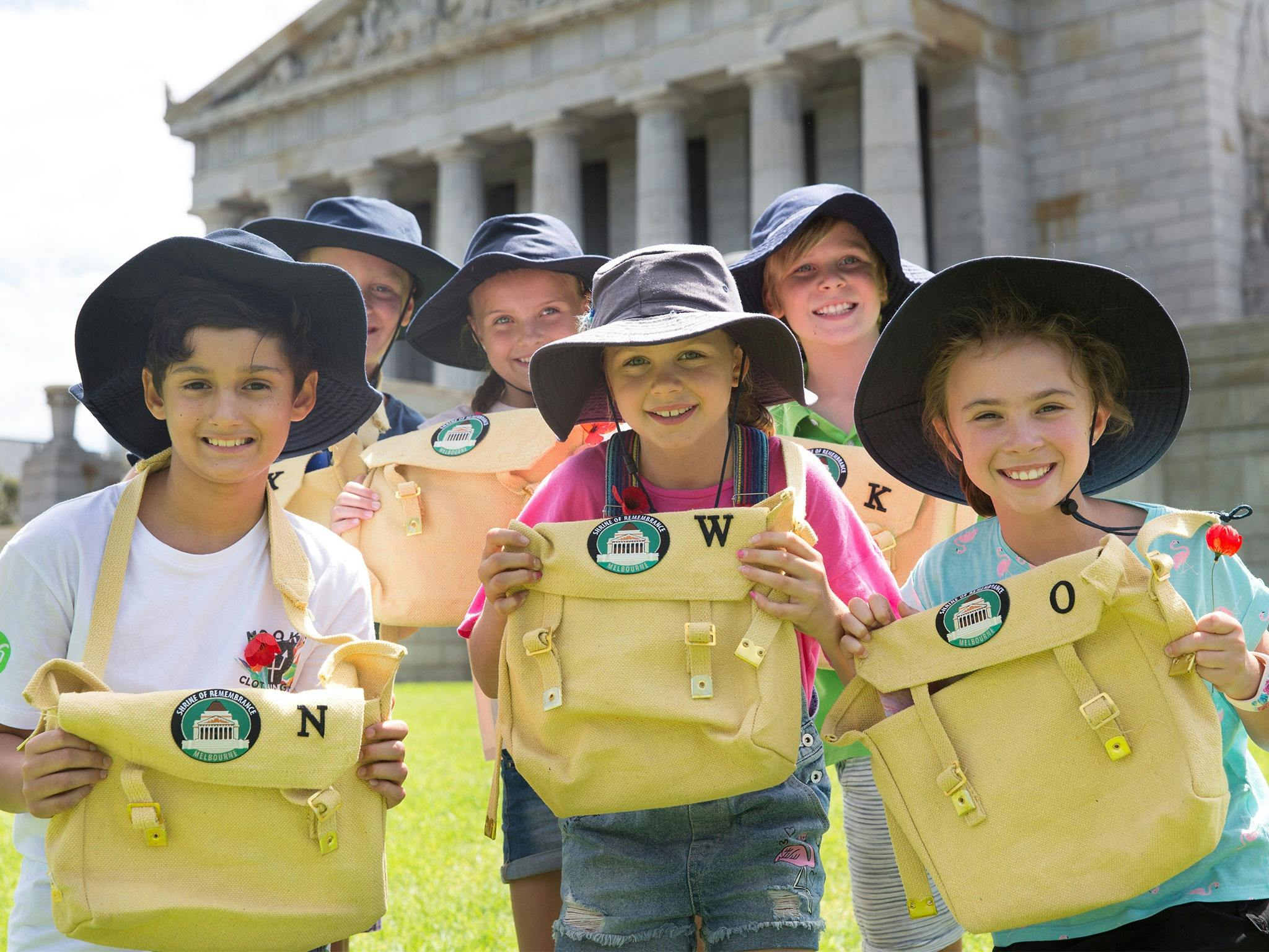 Young friends gather with Explorer Kits on the slopes of the Shrine of Remembrance