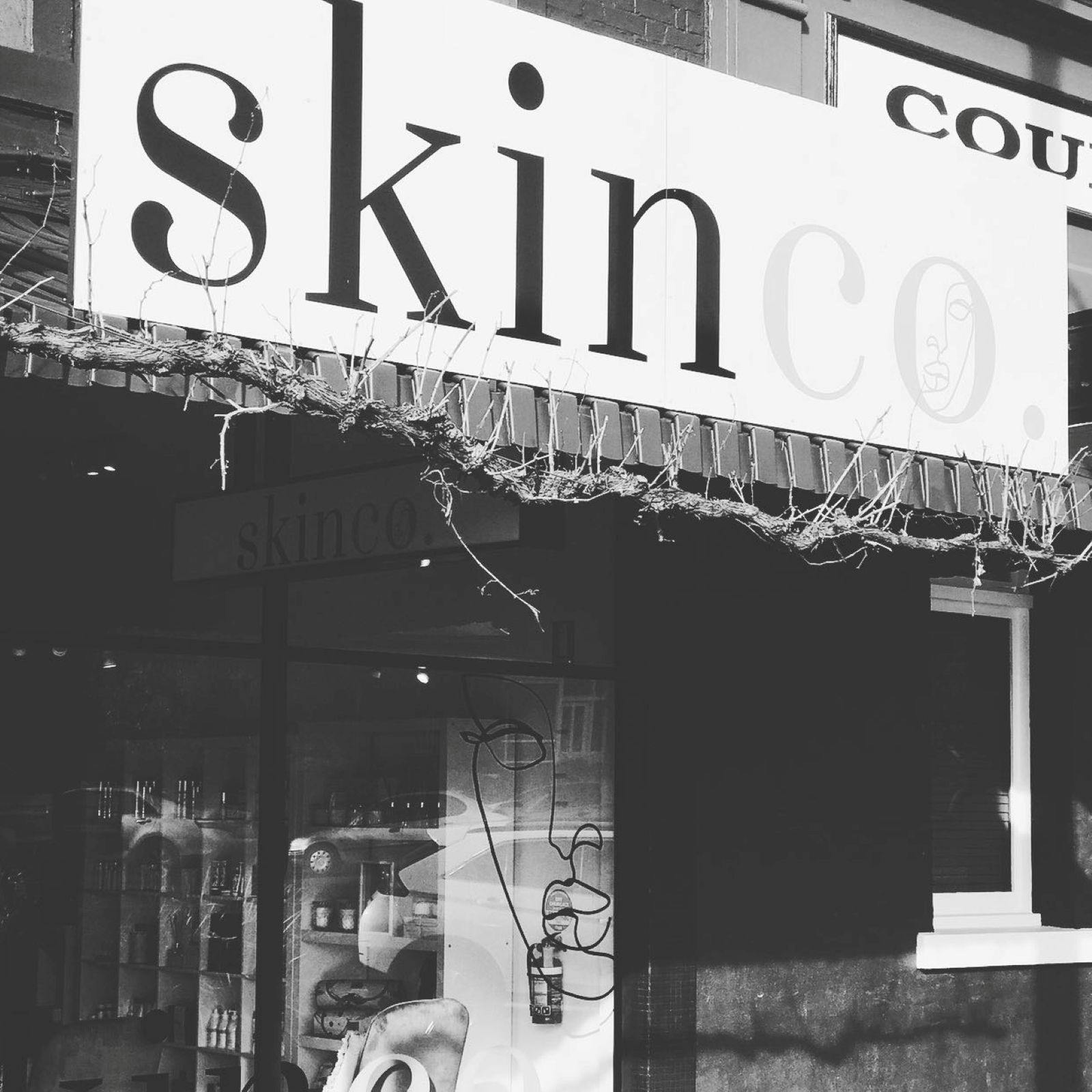 Black and white photo of the exterior of the store