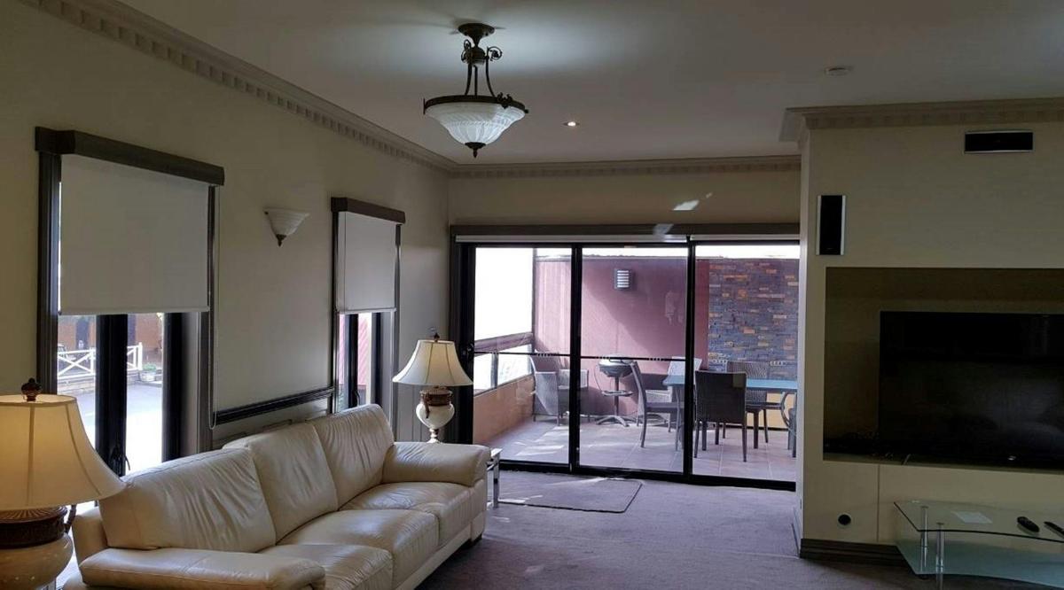 Sir Chester Manifold Suite - Penthouse  - Loungeroom leading to private balcony with BBQ and dining.