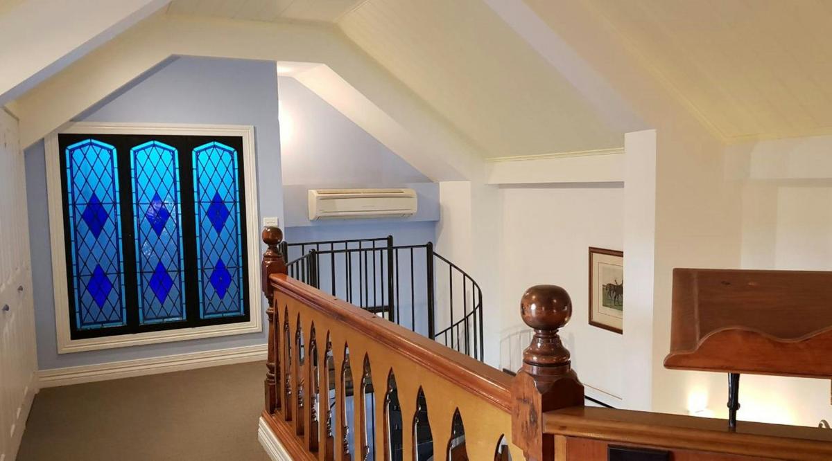 The Vicarage - spiral staircase up to bedroom and spa.