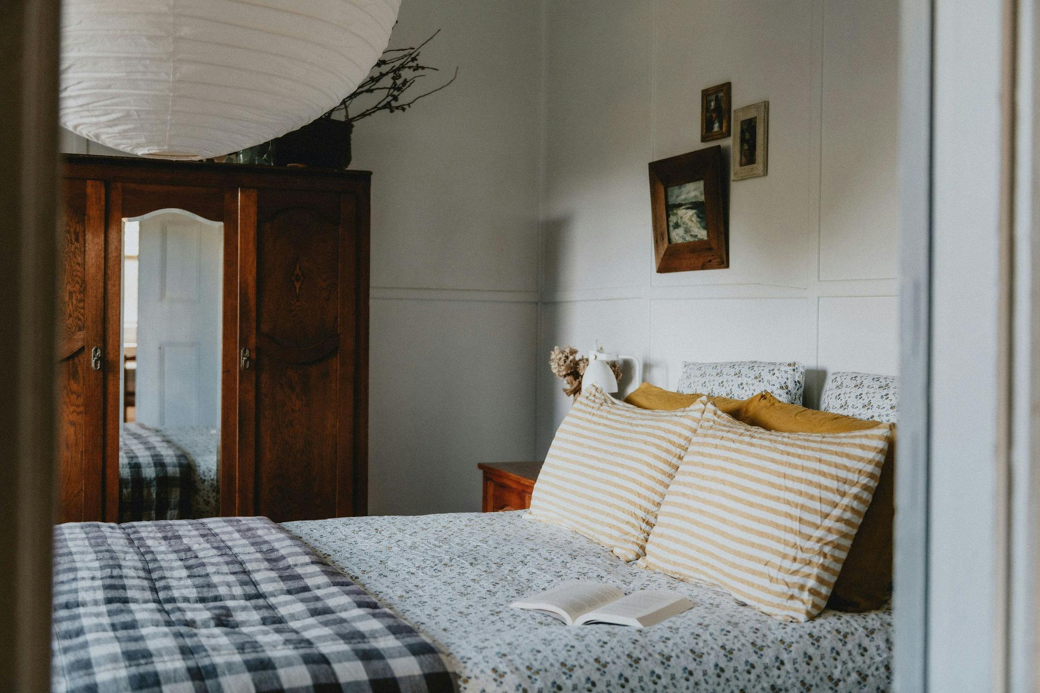 Bedroom two, featuring a queen bed with beautiful french linen.