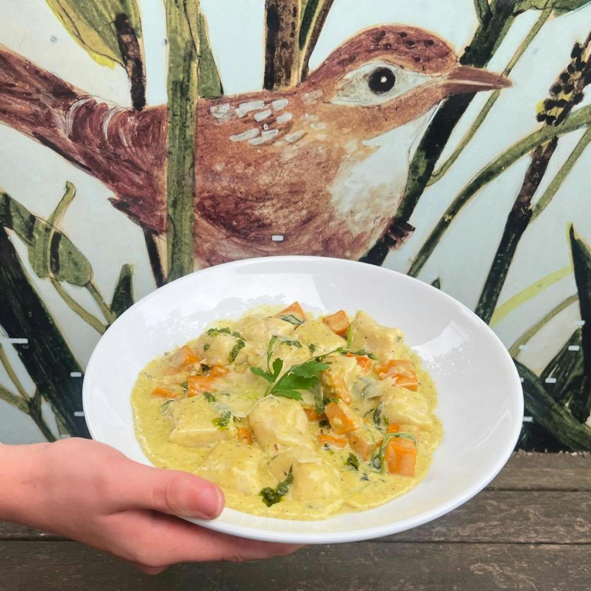 Homemade Gnocchi in a bowl with a wallpaper backdrop