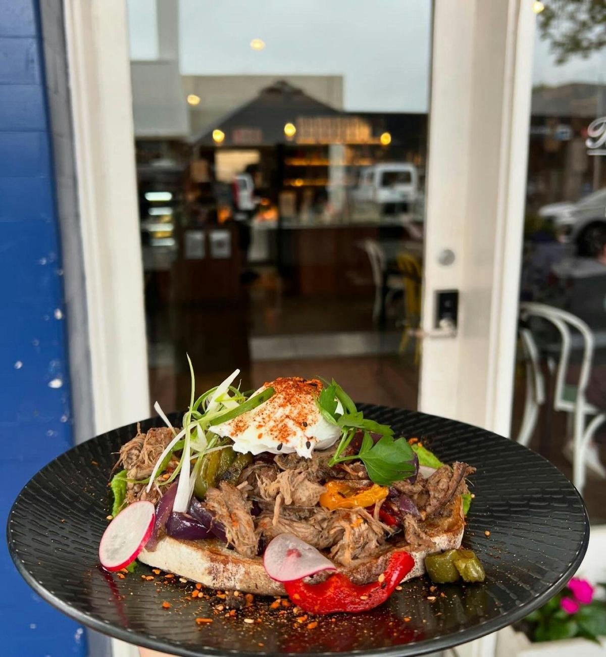 Slow cooked lamb and salad on a plate