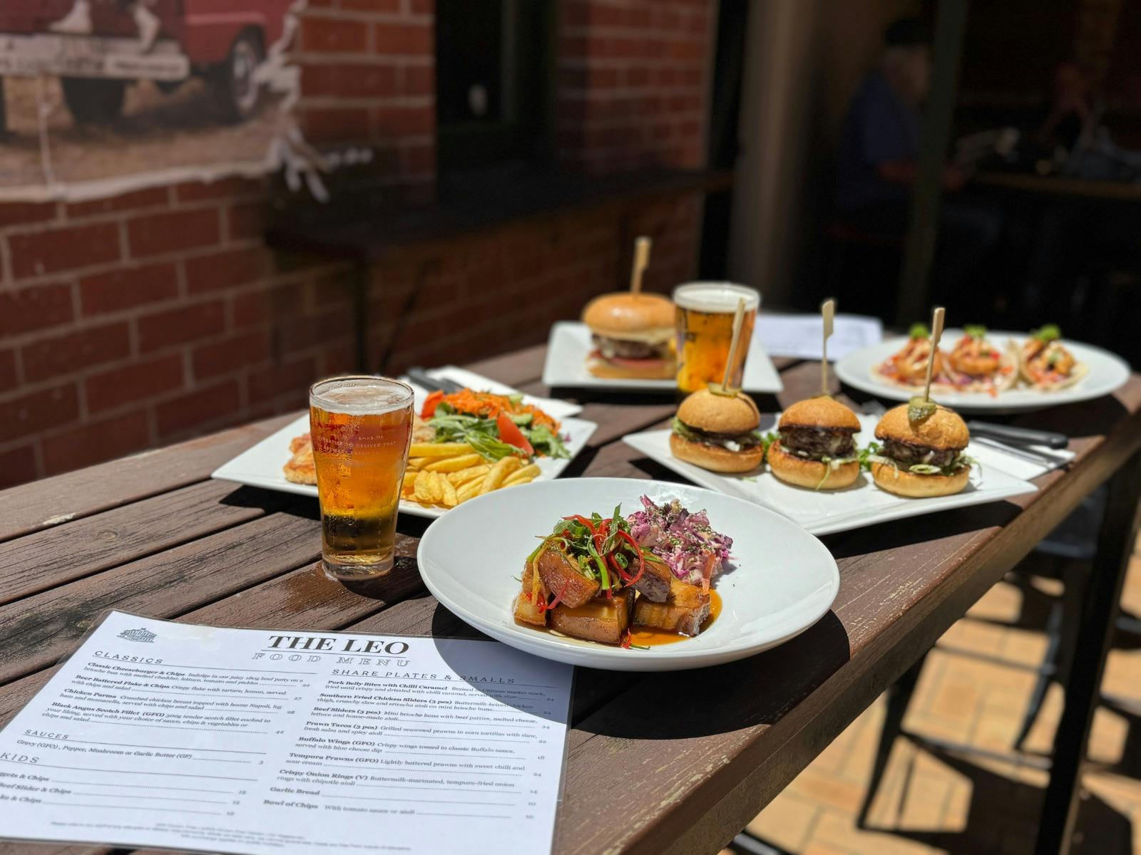 Outdoor table at the Leopold Hotel with pub meals and beers.