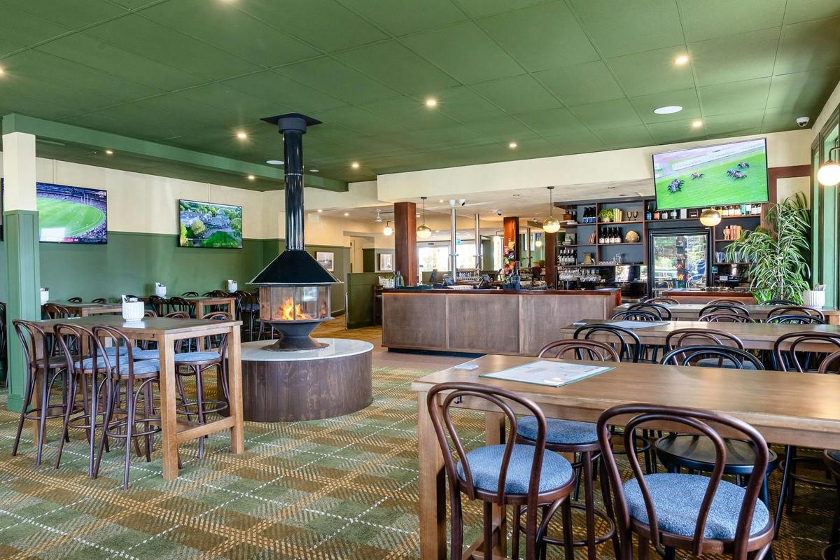 Main bar area, high tables, fireplace centre, open bar