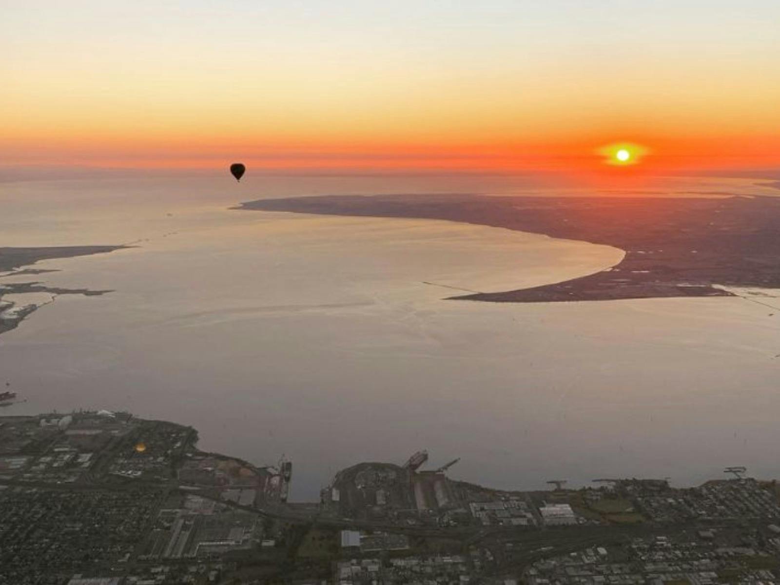 Hot air balloon drifting over Geelong with stunning ocean views