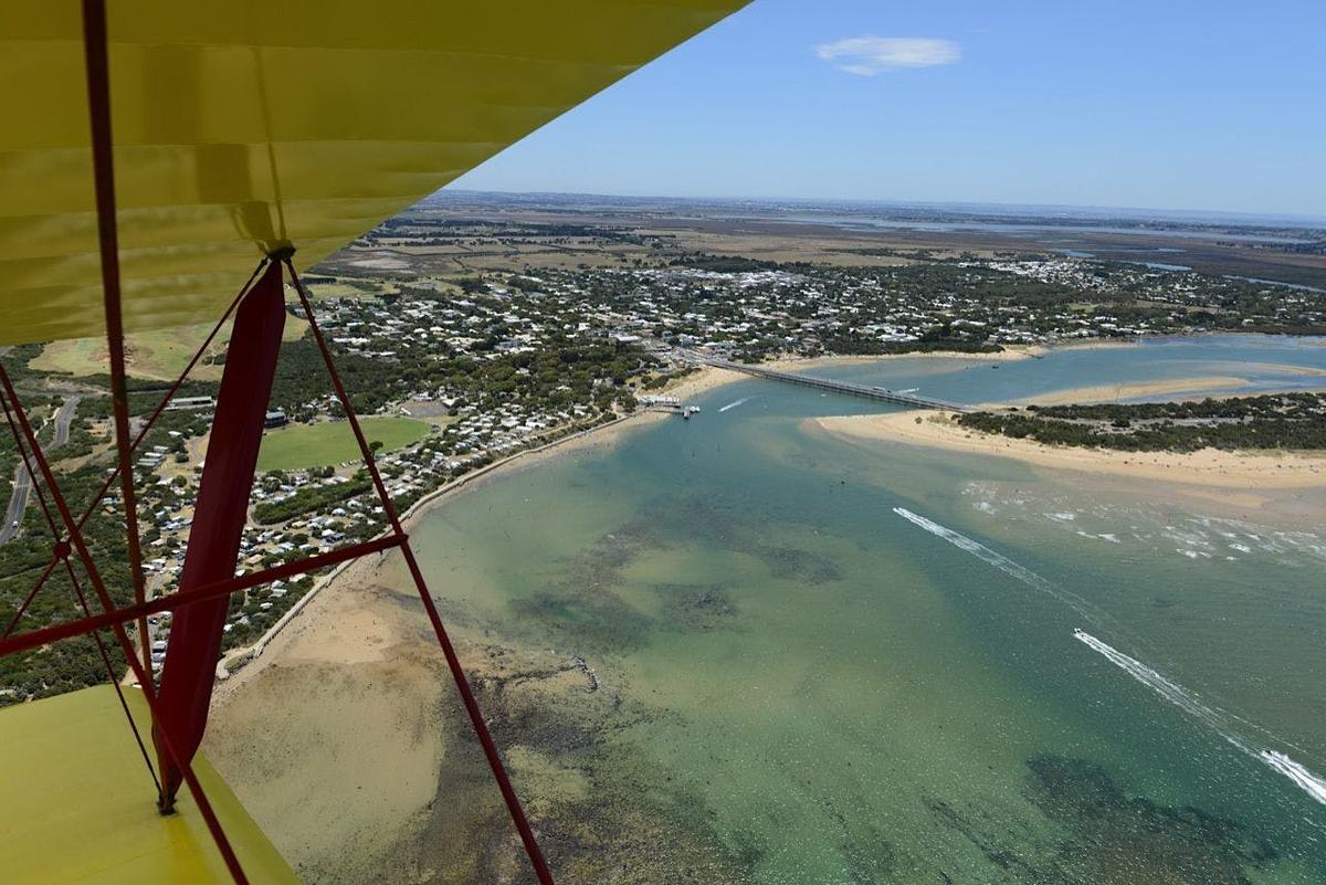 Tiger Moth World adventure flight passing Barwon Heads