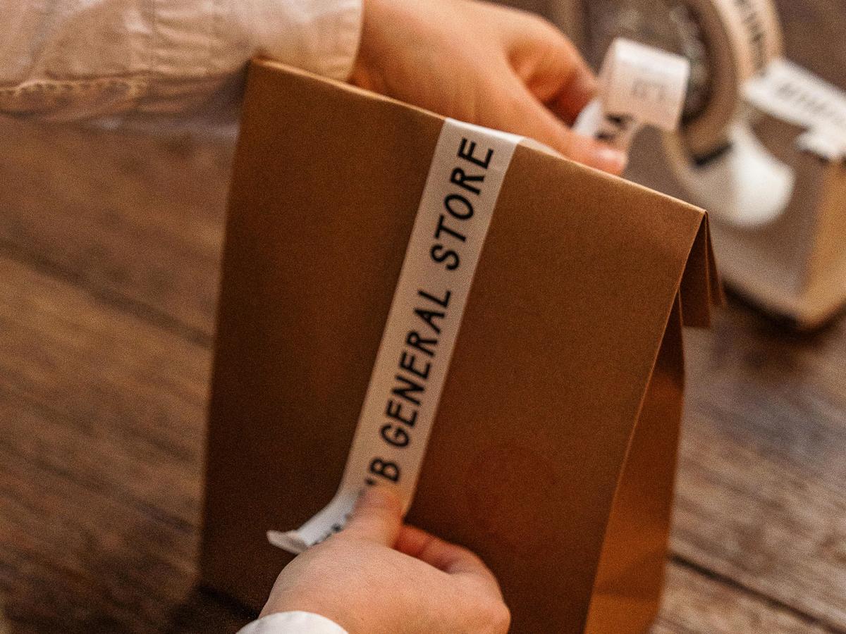 A parcel wrapped at The Hub General Store, where every purchase is packed with quiet care.