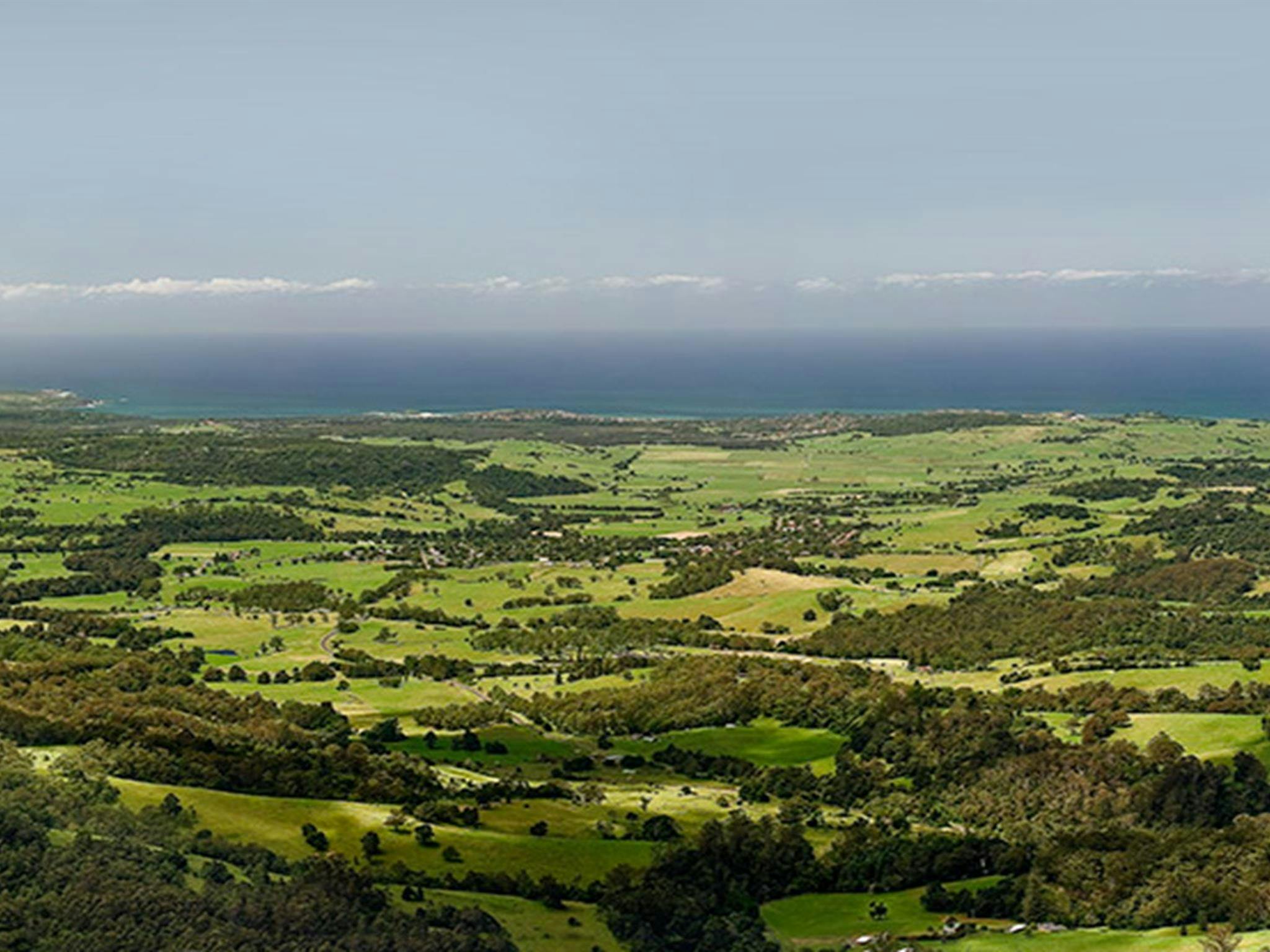 Views of farmland and coastline from Jamberoo lookout, Budderoo National Park. Photo credit: Michael